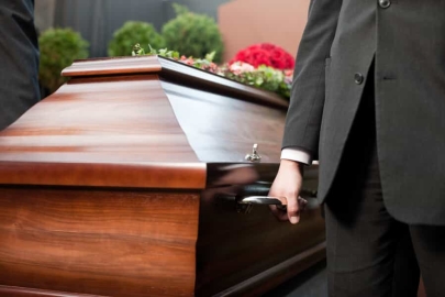 People Holding a Casket
